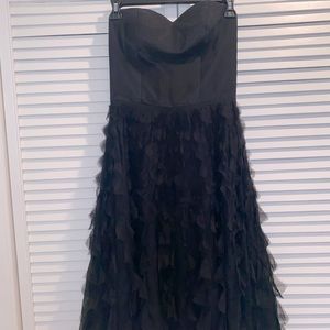 Strapless black dress with ruffles